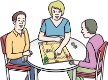 Drei Menschen mit Brettspiel
